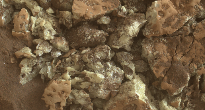 A close-up image of sulfur crystals found inside a rock.
