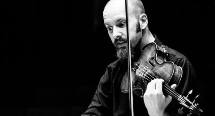 A man plays a violin.