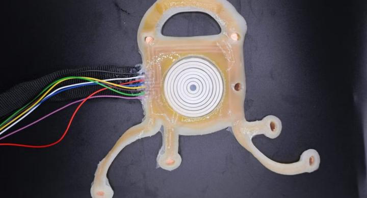 The wearable bioelectronic device is depicted. It has wires leading to a sensor.